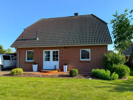 Ansicht - Haus kaufen in Oster-Ohrstedt - Familien-Wohnglück mit guter Raumaufteilung und schönem Garten.