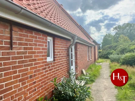 Titelbild - Wohnung mieten in Stuhr - Energetisch sanierte Erdgeschosswohnung im historischen Bauernhaus!