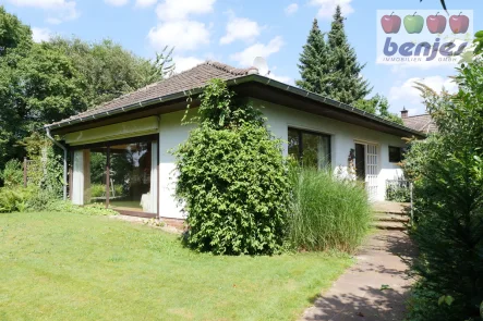 Gepflegter Bungalow - Haus kaufen in Asendorf - Gepflegter Winkelbungalow mit großzügigem Garten in zentraler Wohnlage