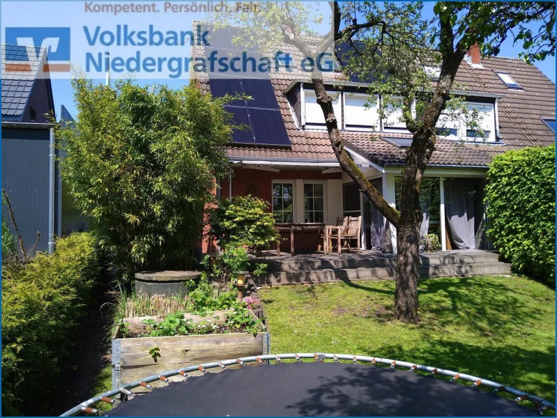 Rückwärtige Ansicht - Haus kaufen in Uelsen - Provisionsfrei für Käufer, Doppelhaushälfte in zentraler Lage