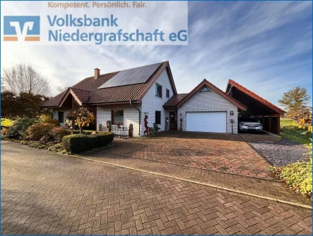 Straßenansicht - Haus kaufen in Georgsdorf - Modernes Einfamilienhaus in Georgsdorf