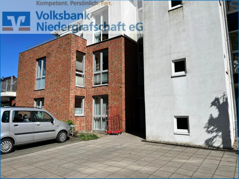 Rückwärtige Ansicht - Wohnung kaufen in Uelsen - 2-Zimmer-Erdgeschoss-Eigentumswohnung in Uelsen 