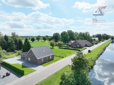 schöne Kanallage - Haus kaufen in Uplengen - Wunderschöne Lage am Kanal - Energieeffizientes Traumhaus