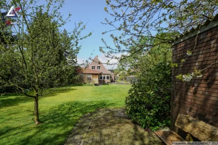 Titelbild - Haus kaufen in Moormerland - Tolles Wohnhaus für die Familie mit großem Garten