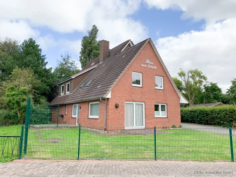 Mehrfamilienhaus - Wohnung kaufen in Büsum - Moderne, große 3-Zimmer-Wohnung mit ca. 126 m² Wohnfläche, 2 Terrassen, Garten und Carport in ruhiger Wohngegend