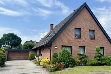 Außenansicht - Haus kaufen in Kiebitzreihe - Großzügiges Zweifamilienhaus auf einem ca. 746 m² großen Grundstück zu verkaufen