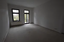 Wohnzimmer mit Balkon