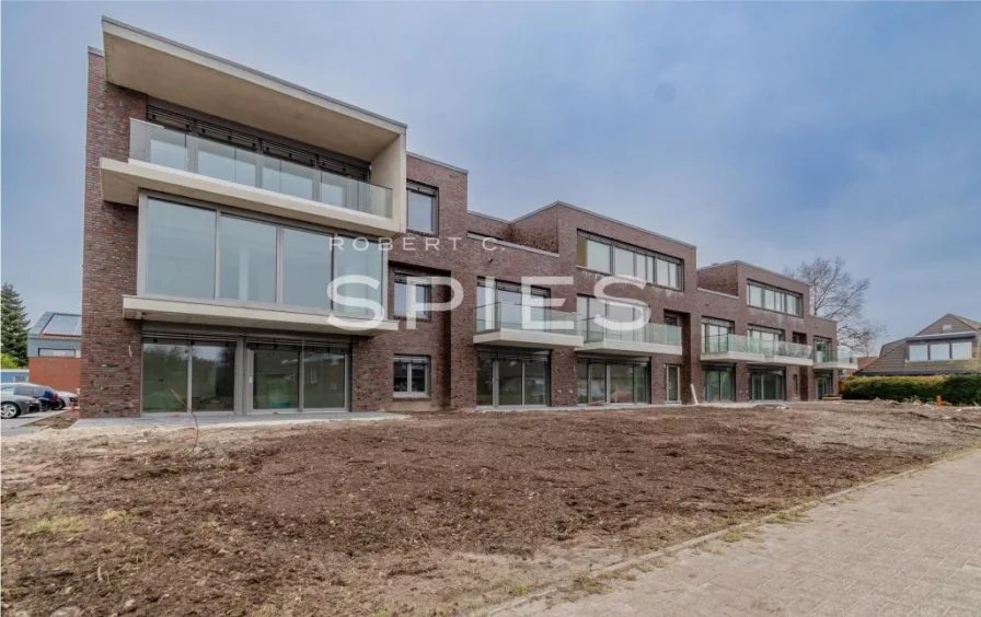 Titelbild - Wohnung kaufen in Jever - Neubauwohnung in Jever / Erdgeschosswohnung mit Terrasse und Garten