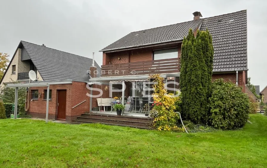 Gartenansicht - Haus kaufen in Lemwerder - Gepflegtes Einfamilienhaus in familienfreundlicher Wohnlage
