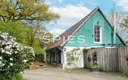 Ansicht - Haus kaufen in Westerstede - Bezauberndes Einfamilienhaus auf einem idyllischen Grundstück in Westerstede-Moorburg
