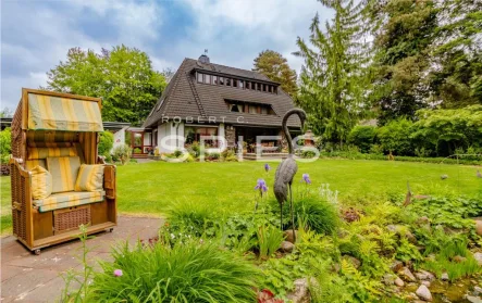 Außenansicht - Haus kaufen in Stuhr - Freistehendes Einfamilienhaus mit idyllischem Garten in Heiligenrode