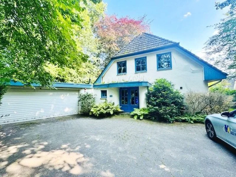  - Haus kaufen in Schwanewede - Architektenhaus in der Bremer Schweiz mit Doppelgarage, großem Baumbestand in Leuchtenburg