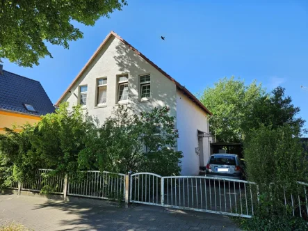 Außenansicht  - Haus kaufen in Bremen / Farge - Freistehendes Ein- bis Zweifamilienhaus mit Garten und Carport in Bremen- Farge