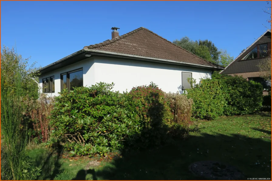 Straßenansicht - Haus kaufen in Loxstedt / Stinstedt - Bungalow mit Garage und großem Grundstück in Stinstedt-Loxstedt