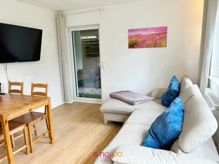 Zugang zur Terrasse - Wohnung kaufen in Wolfenbüttel - Moderne Wohnung mit Garten und überdachter Terrasse in zweiter Reihe!