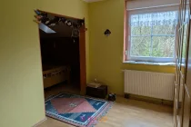 Schlafzimmer mit Ankleidebereich