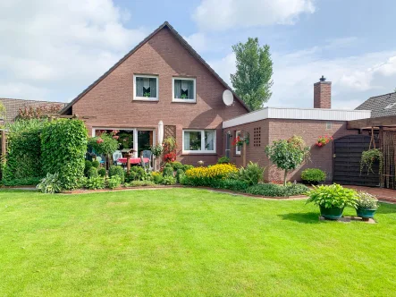 Titelbild - Haus kaufen in Apen - Sehr gepflegtes Einfamilienhaus mit schönem Garten und Garage in Apen zu verkaufen!