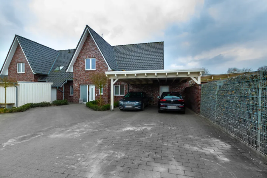 Titelbild - Haus kaufen in Edewecht - Attraktives und modernes Zweifamilienhaus in ruhiger Lage zu verkaufen! Keine Käuferprovision!