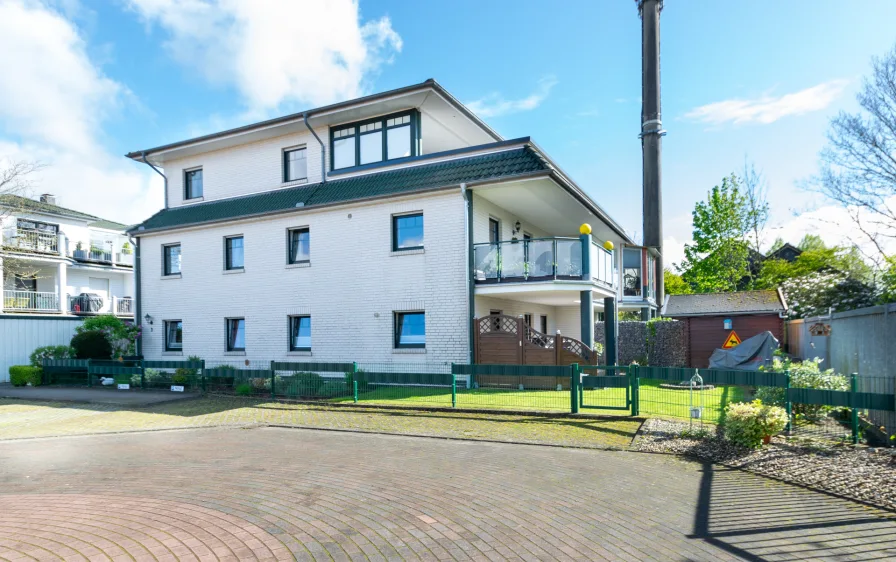 Hausansicht - Wohnung kaufen in Wiefelstede - Gepflegte 3-Zimmer-Wohnung mit tollem Balkon in zentraler Lage von Wiefelstede zu verkaufen!