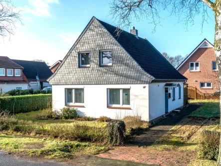 Straßenansicht - Haus kaufen in Oldenburg - Einfamilienhaus in ruhiger Lage in Ofenerdiek