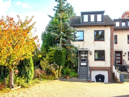 Straßenansicht - Haus kaufen in Wardenburg-Hundsmühlen - Besonderes Reihenendhaus mit Hunteblick