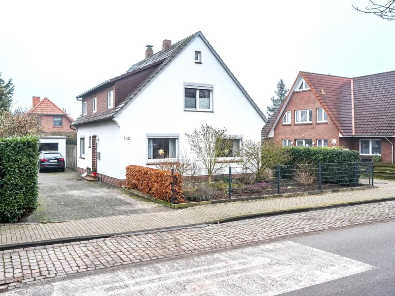 Straßenansicht - Haus kaufen in Oldenburg - Gepflegtes, freiwerdendes Einfamilienhaus in ruhiger Wohnlage