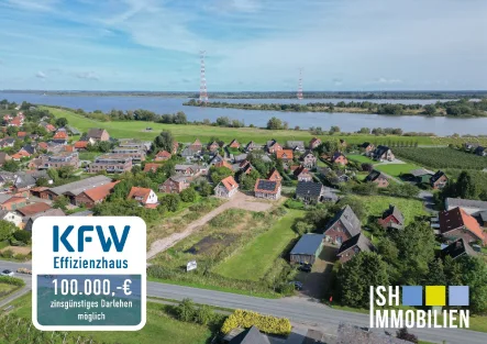 Luftbild - Wohnung kaufen in Hollern-Twielenfleth - Fachwerkliebe an der Elbe: gemütliche Maisonettewohnung mit Charme