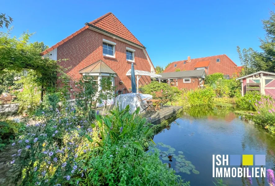 Gartenansicht - Haus kaufen in Harsefeld - Hochwertige Doppelhaushälfte in ruhiger und zentraler Lage mit Traumgarten