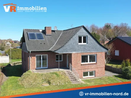Ansicht Süd der Immobilie - Haus kaufen in Owschlag - Einfamilienhaus mit Ausbaureserve und Baugrundstück - sofort verfügbar!