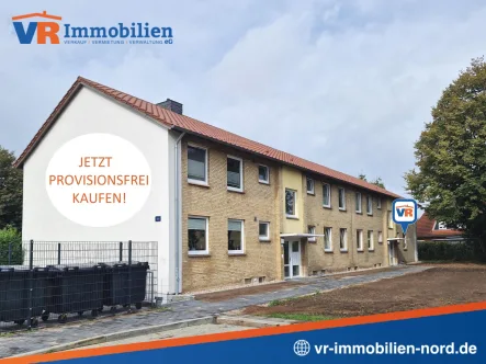 Die Straßenansicht des Mehrfamilienhauses - Wohnung kaufen in Tarp - Attraktive 3-Zimmer-Erdgeschosswohnung mit Terrasse und eigenem Stellplatz - ideal für jung und alt