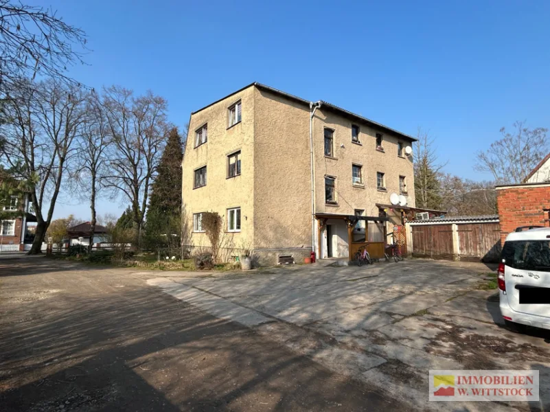 Rückansicht  - Haus kaufen in Pritzwalk - Großes Grundstück mit 3 Familienhaus und Nebengelass an der Dömnitz in ruhiger Wohnlage