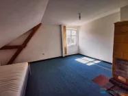 Ein Dachgeschoßzimmer