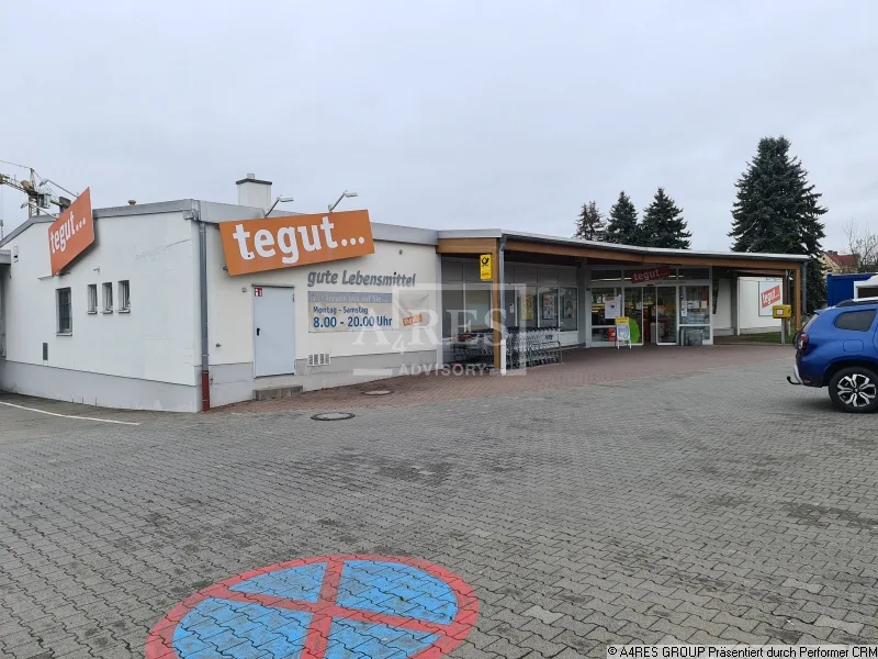 Objektansicht - Zinshaus/Renditeobjekt kaufen in Nüdlingen - Supermarkt in Nüdlingen