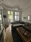 Wohnzimmer mit Balkon