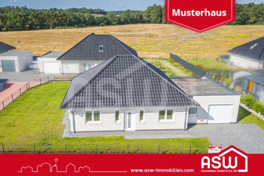 Vorderansicht - Haus kaufen in Herzlake - Top Preis-Leistung! Bezugsfertiger Neubaubungalow KfW 40 mit Garage!