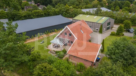 Seitenansicht - Haus kaufen in Dohren - Wohn- und Gewerbeimmobilie. Einfamilienhaus nebst massivem Carport und 2 Hallen!