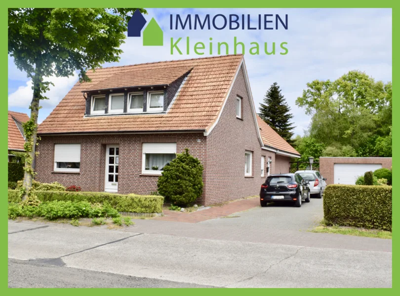 Straßenansicht - Haus kaufen in Papenburg - Zweifamilienhaus am Kanal zu Kaufen!