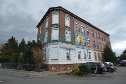 Seitenansicht - Haus kaufen in Eilenburg - 4-Parteien-Mehrfamilienhaus in der Heinzelmännchen-Stadt Eilenburg