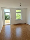 Wohnzimmer mit Balkon