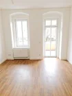 Wohnzimmer mit Balkon