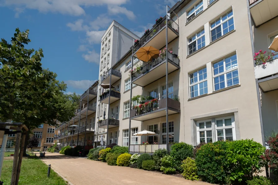 Hofansicht - Wohnung kaufen in Leipzig - RARITÄT // Hochwertige Wohnung mit Parkett und Balkon im "Klangwerk" in Leipzig-Stötteritz