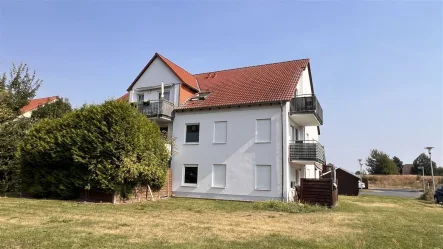 Gartenansicht - Haus kaufen in Gommern - Vollvermietetes 6 FH in Gommern - Ruhiges Wohnen im Grünen