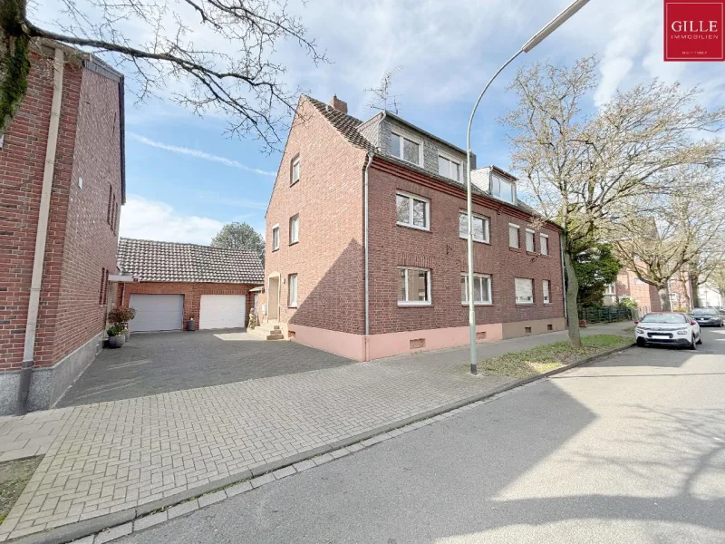  - Haus kaufen in Neuss - Teilmodernisiertes Dreifamilienhaus als Doppelhaushälfte in beliebter Lage von Neuss-Holzheim
