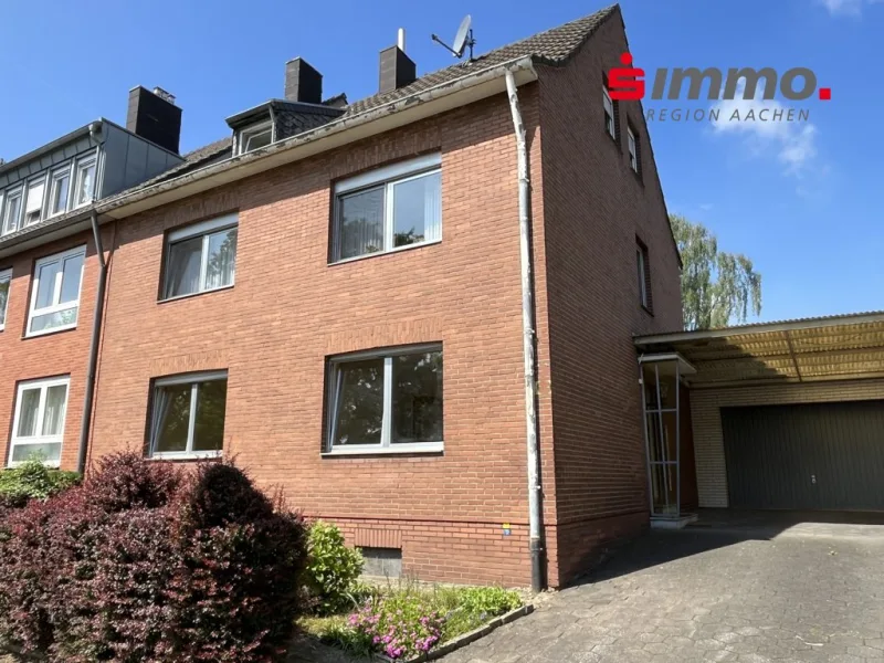 Titelbild - Zinshaus/Renditeobjekt kaufen in Würselen - Teilweise vermietetes Dreifamilienhaus mit Garage und großem Garten im Herzen von Würselen