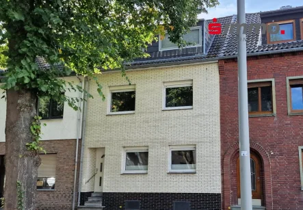 Titelbild - Haus kaufen in Würselen - Gepflegtes Einfamilienhaus mit drei Bädern und Sonnengarten im Herzen von Würselen