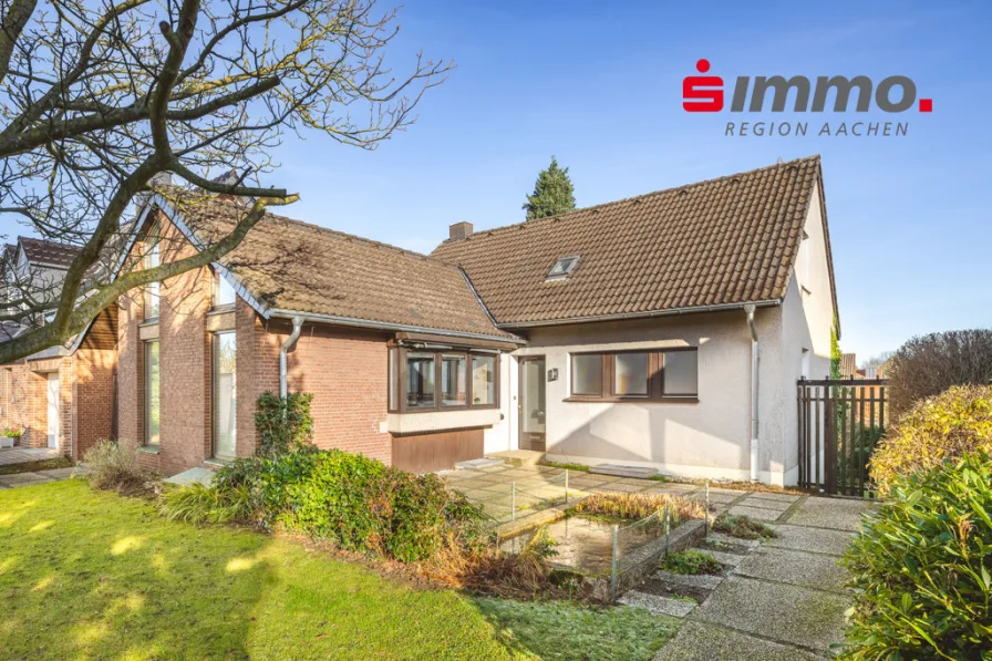 Titelbild mit Logo - Haus kaufen in Herzogenrath - Freistehendes Einfamilienhaus mit Garage in Erbpacht