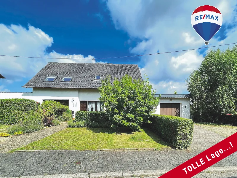 Vorderansicht - Haus kaufen in Tholey - IDEAL für Familien:ADRETTES Einfamilienhaus mit HERRLICHEM Garten + Garage in ruhiger Lage...!