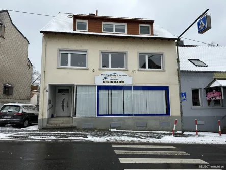 Ansicht - Haus kaufen in Neunkirchen/Saar - Wohn- und Geschäftshaus mit Garage und Lager