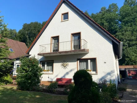 Ansicht - Haus kaufen in Zweibrücken / Bubenhausen - Einfamilienhaus in ruhiger Lage mit Doppelgarage und großem Garten aus Insolvenzverwertung