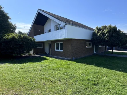 Seitenansicht  - Haus kaufen in Schermbeck - Familiengerechte Wohnlage! Freistehendes Architektenhaus mit Kamin in Altschermbeck